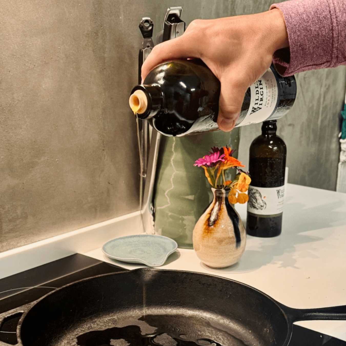 Pouring bottle onto pan