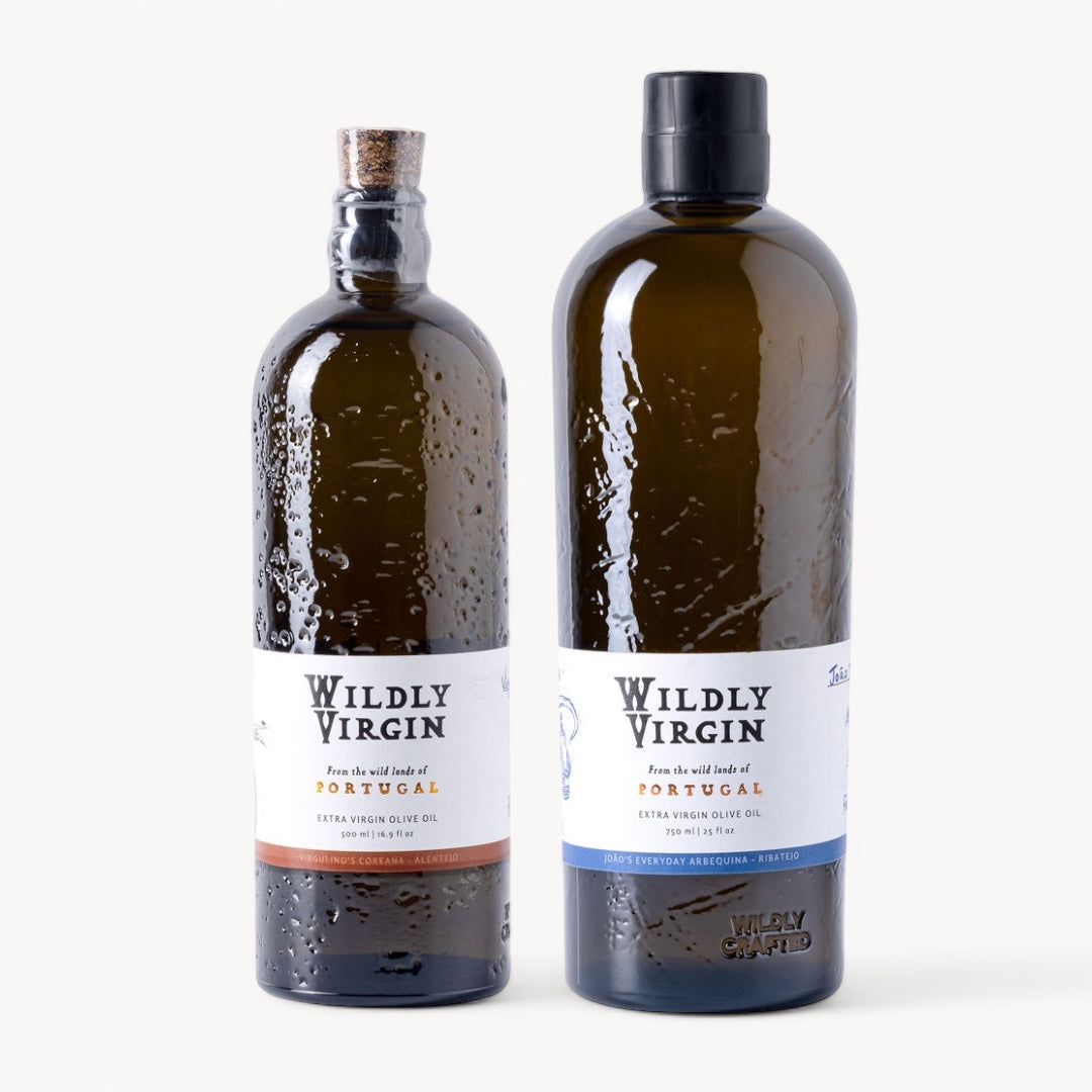 Two bottles of Wildly Virgin extra virgin olive oil from Portugal, showcasing artisanal flavors for gourmet cooking.