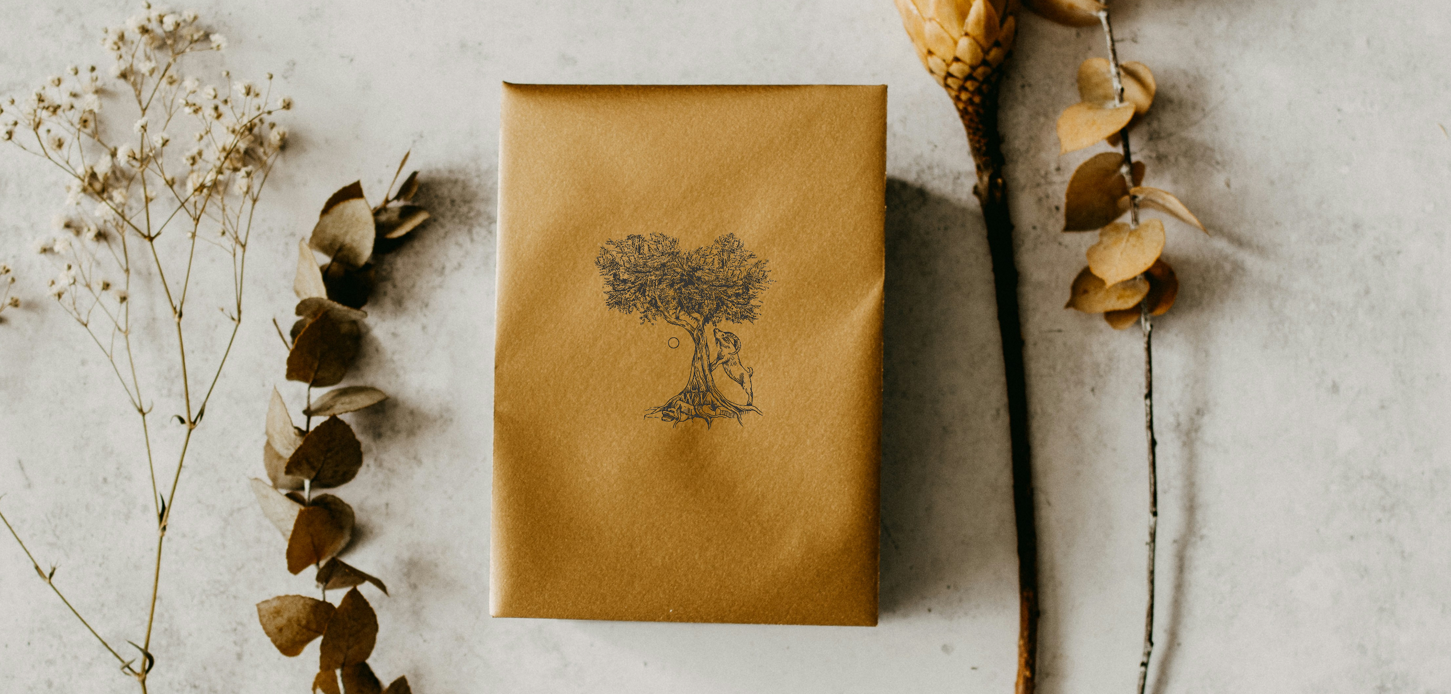 Kraft paper wrapped gift with artistic tree print