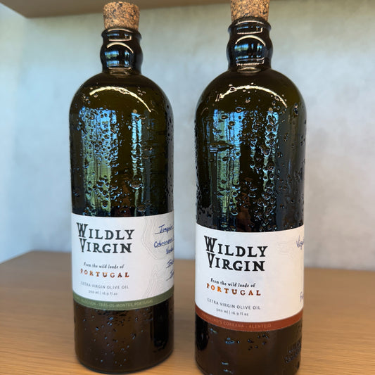 Wildly Virgin olive oils from Portugal, showcasing Verde and Forte varieties in glass bottles with droplets.