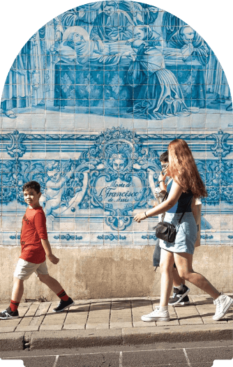 A family walking past famous Azulejo tiles in Portugal