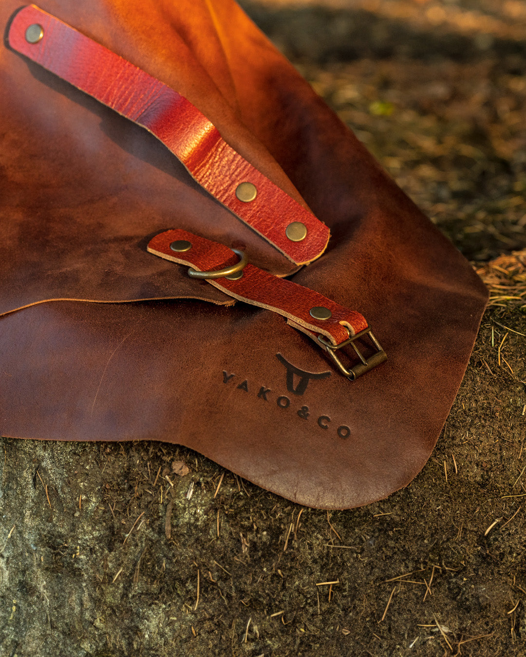 Leather Apron by Yako & Co showcasing full-grain leather with adjustable straps and logo detail.