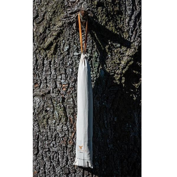 Leather Apron included in reusable cotton bag hanging on a tree.