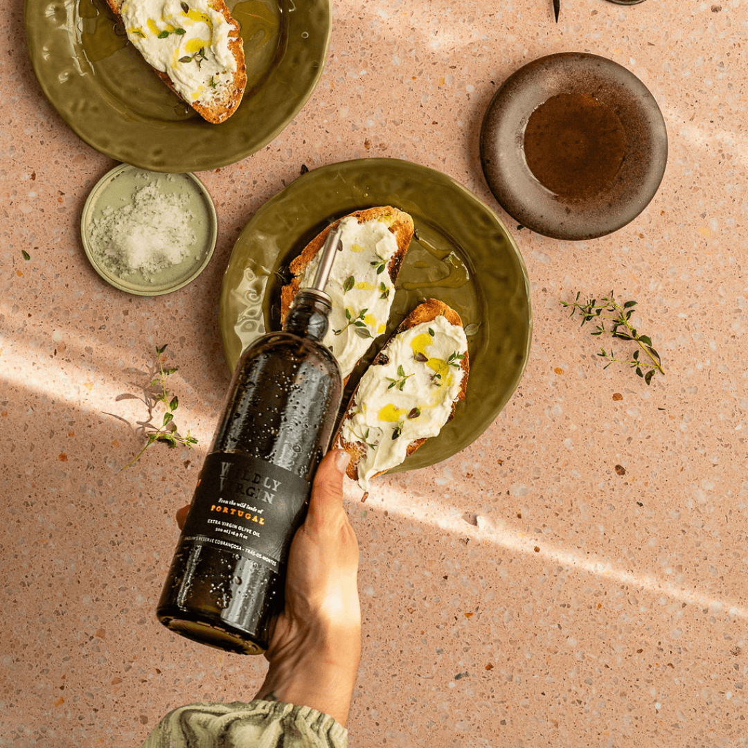 pouring bottle onto crostini
