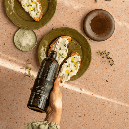 pouring bottle onto crostini