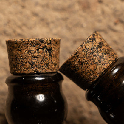Close-up of cork stoppers on bottles from The Explorer Set, showcasing unique textures and craftsmanship.