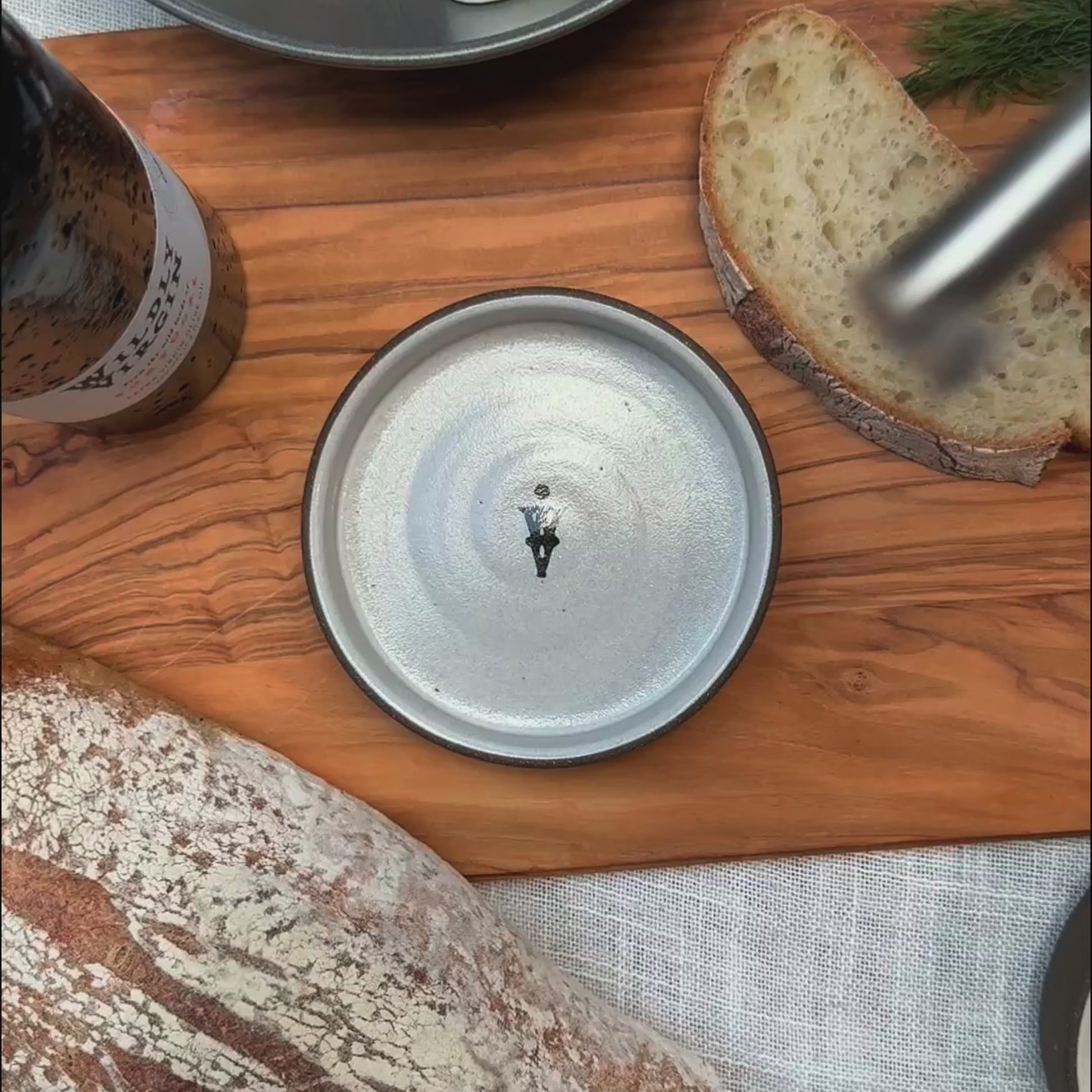 Tour of Portugal Gift Set featuring a hand-turned olive oil dish on a wooden board with bread and olive oil.