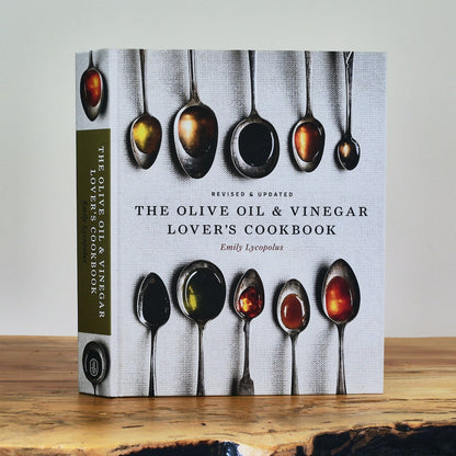 Cover of The Olive Oil & Vinegar Lover's Cookbook by Emily Lycopolus, featuring spoons with oils and vinegars.