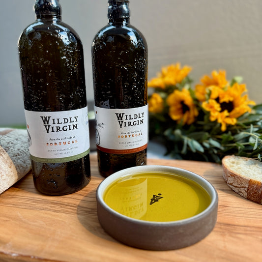 Tour of Portugal Gift Set featuring Wildly Virgin olive oils and a hand-turned dipping dish surrounded by bread and flowers.