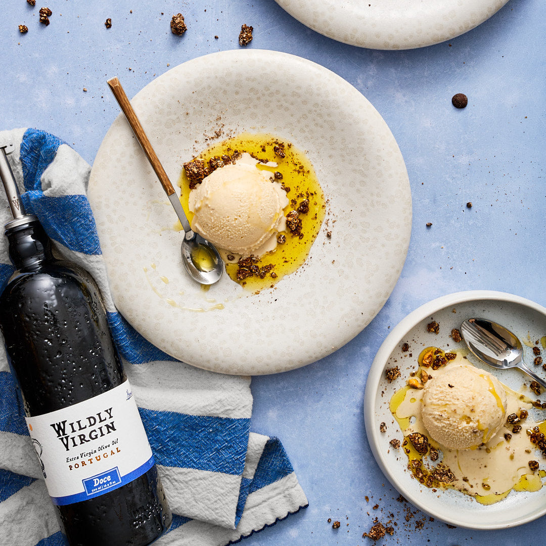 Doce drizzled over ice cream on a plate, showcasing its smooth and sweet qualities.